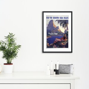 May include: Vintage travel poster advertising a trip to the South Sea Islands. The poster features a colorful illustration of a tropical island with a mountain, palm trees, a woman in a grass skirt, and a seaplane flying overhead. The text "Fly to South Sea Isles" is printed in blue at the top of the poster.