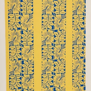 May include: A rectangular fabric textile featuring a repeating pattern of yellow hibiscus flowers and leaves set against a vibrant blue background, organized into vertical columns separated by solid yellow stripes.