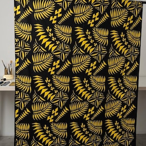 May include: A rectangular fabric panel featuring a repeating pattern of yellow fern leaves and geometric shapes printed on a solid black background. The design is arranged in vertical columns, creating a consistent botanical and tribal-inspired motif.