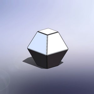 May include: A black and white geometric lamp with a square base and a diamond-shaped top. The lamp is lit and has a white glow.