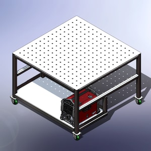 May include: A metal welding table with a perforated top surface and a red welding machine underneath. The table has four wheels and is on a gray background.