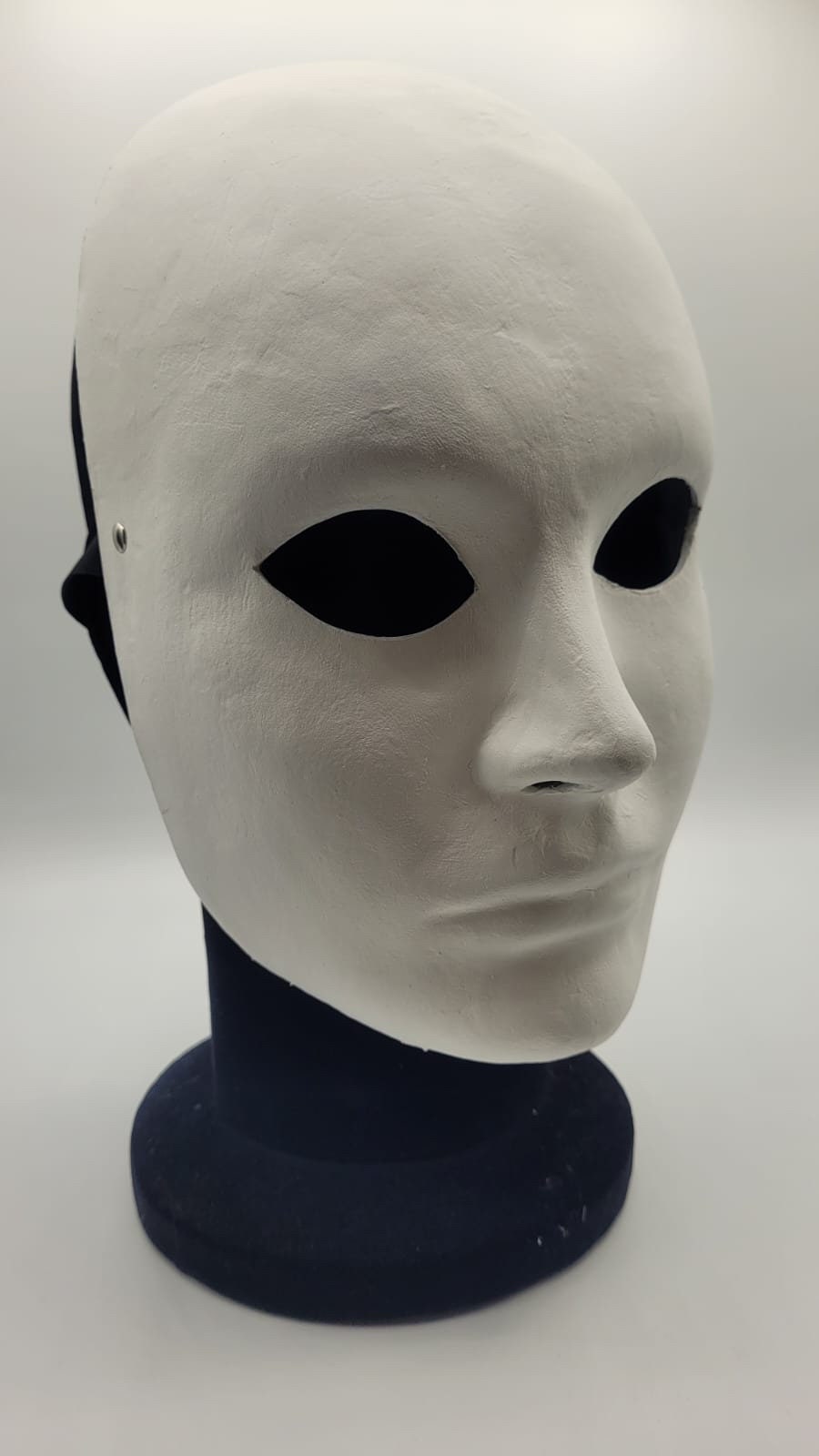 Premium Photo  Expressionless white masks on a black cloth
