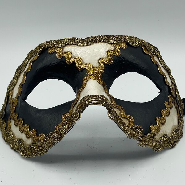 Venetian mask black, white and gold. Colombina mask .