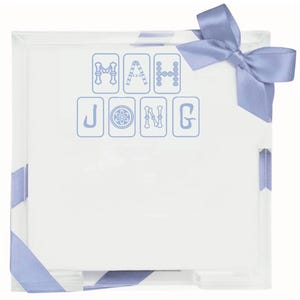 May include: A square, clear acrylic box featuring the word MAH JONG printed in light blue on the front, with each letter styled like a game tile. The box is wrapped with a light blue satin ribbon tied into a bow at the top right corner.