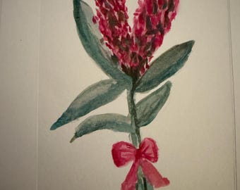 May include: Watercolor painting of a floral arrangement with two large, textured, burgundy flower heads. The stems have teal-colored leaves and are tied with a pink bow. The words "Warm Gafflina" are written in cursive at the bottom.