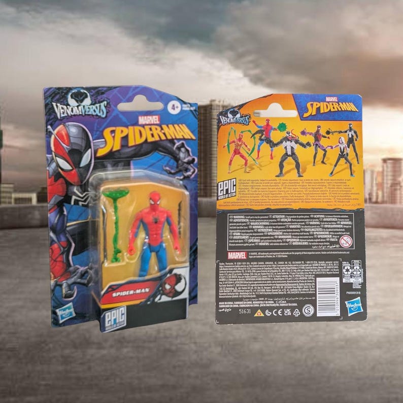 May include: Two Marvel Spider-Man action figures in their original packaging. The front of the packaging features the words "Venom Versus" and "Spider-Man". The Spider-Man figure is red and blue. The back of the packaging shows other characters.