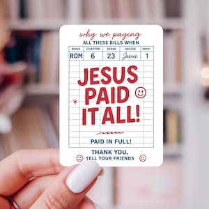 May include: A white sticker with red and blue text. The sticker reads "JESUS PAID IT ALL!" in large red letters. The top of the sticker says "why we paying ALL THESE BILLS WHEN". The sticker has a grid pattern.