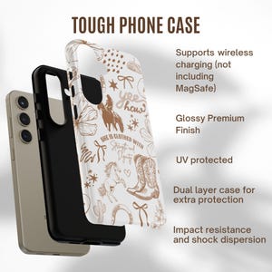 May include: A white phone case with a brown and white pattern of horses, boots, and other western-themed designs. The text "yee haw" and "She is clothed with strength and dignity" are printed on the case. The case is compatible with wireless charging, but not MagSafe.