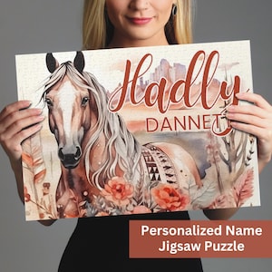 May include: Personalized jigsaw puzzle featuring a watercolor painting of a brown horse with a floral background. The name "Hadly Dannet" is written in red cursive lettering.