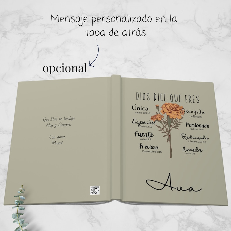 May include: A beige book with a floral design on the cover. The book has the text "Dios dice que eres" and a list of words with bible verses. The words are "unica", "especial", "fuerte", "preciosa", "escogida", "perdonada", "redimida", and "amada". The book also has the text "Ava" written on the cover.
