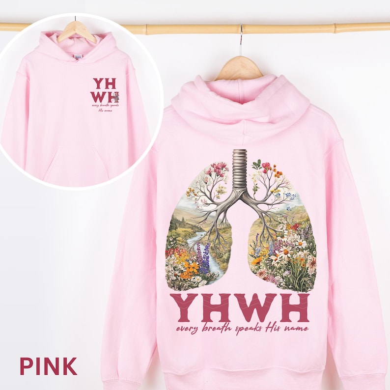 May include: Pink hoodie with a floral lung design and the text "YHWY every breath speaks His name".