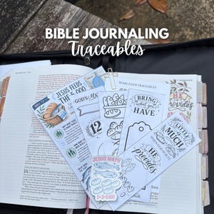 May include: A collection of Bible journaling traceables featuring black and white illustrations of bread and fish, with text including "Jesus Feeds the 5,000," "Bring What You Have," and "Little is Much When God is in It," resting on an open Bible.