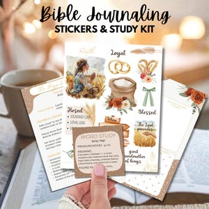 May include: Bible journaling stickers and study kit. The kit includes stickers with illustrations of wheat, flowers, and wedding rings. The kit also includes study cards with text about Ruth, loyalty, and steadfast love. A hand is holding a study card.