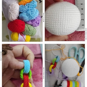 Puede incluir: Una colección de ovillos de lana coloridos en varios colores, incluyendo verde, azul, rojo y amarillo. Se muestra una bola blanca de ganchillo, de aproximadamente 7.6 cm de diámetro, con una regla. También se ven eslabones de cadena de ganchillo y un tubo de ganchillo arcoíris.