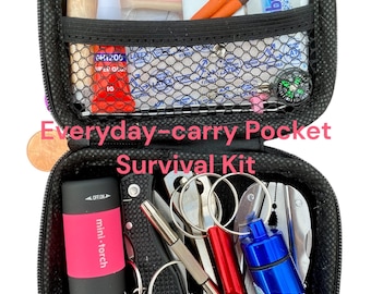 May include: Black zippered survival kit with various tools and supplies. Includes a mini-torch, knife, whistle, compass, matches, and first aid items. The text "Everyday-carry Pocket Survival Kit" is visible.