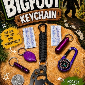 May include: A collection of Bigfoot-themed keychains and survival tools. The image features a black multi-tool, a compass, a whistle, and a small container, all in purple. The keychains are arranged on a rock with the text "Kids Bigfoot Keychain".