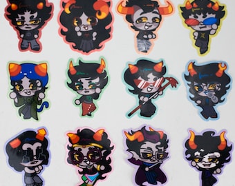 May include: A sheet of twelve colorful stickers featuring cartoon characters with horns, dark hair, and various outfits. Each sticker has a unique design, with different poses and accessories. The stickers are on a white background.