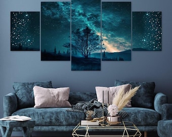 May include: A five-panel wall art set depicting a night sky with a glowing teal and blue nebula, stars, and a silhouette of a tree. The artwork is arranged in a staggered layout, creating a panoramic view of a celestial landscape above a dark horizon.
