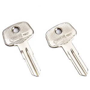 May include: Two silver-toned keys with the text "CERRI ITALY" on the top. The keys have a single hole in the top and a double-sided blade.