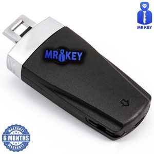 以下が含まれることがあります： 黒と銀の車のキーフォブで、銀のキーブレードと黒いボタンが付いています。フォブには青い文字で「MR KEY」と印刷されています。フォブには6ヶ月の保証が付いています。