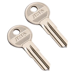 May include: Two silver-colored keys with the text "JMA" on the head. The keys have a circular head with a hole and a textured pattern. The key blades are cut with grooves.