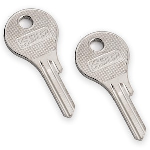 May include: Two silver-colored keys with the brand name "SILCA" imprinted on the key heads. The keys have a textured surface and a hole at the top. The key blades are cut with a series of grooves.