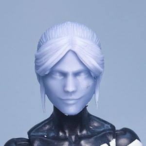 May include: A white female action figure head with black hair. The head is unpainted and has a neutral expression.