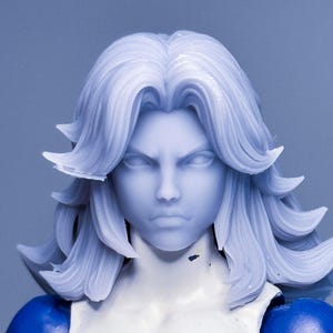 May include: A white female action figure with long, white hair. She is wearing a blue suit with a white circle on the chest with a black number "4" inside.