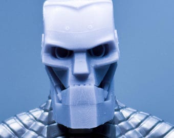 May include: A light blue robot head and upper torso, futuristic in design. The head is rectangular with detailed facial features, including eye sockets and a defined jawline. The torso has a textured, grid-like pattern in a metallic silver colour.