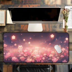 May include: A rectangular mousepad featuring a whimsical design with cartoon cats amidst pink cherry blossoms and a starry sky. A white computer mouse rests on the pad. The color palette includes pink, purple, and white.
