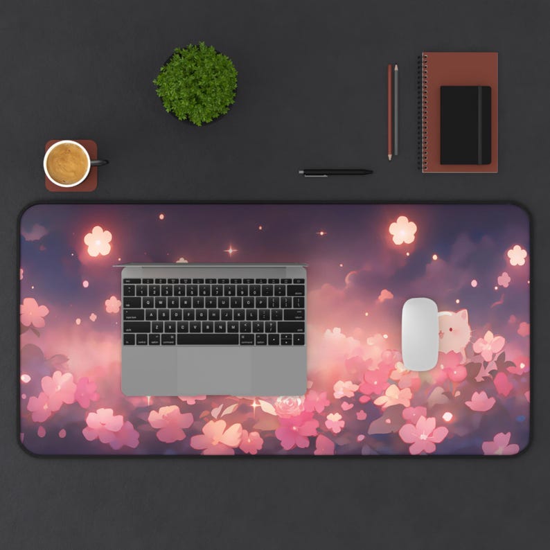 May include: A rectangular desk mat featuring a floral design with pink blossoms and a dreamy sky background. A silver keyboard, white mouse, and other office supplies are arranged on the mat.