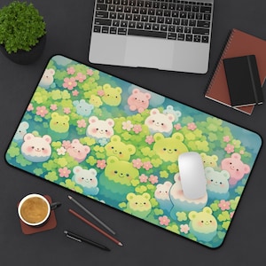 May include: A rectangular mousepad featuring a whimsical design of cartoon bears in shades of green, pink, and blue, surrounded by flowers. The mousepad has a black border and a white mouse is on top.