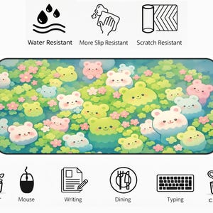 May include: Rectangular mouse pad featuring a whimsical design of cartoon bears in a floral setting. The pad is water, slip, and scratch resistant. Icons at the top indicate these features. Additional icons at the bottom suggest uses for decor, mouse, writing, dining, typing, and crafting.