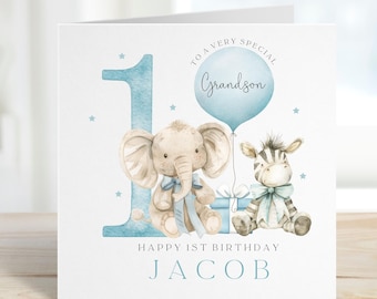 May include: A blue and white birthday card with a blue number one, a blue balloon that says "To a very special Grandson", an elephant and a zebra holding gifts. The card says "Happy 1st Birthday Jacob".