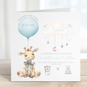 May include: A baby announcement card with a watercolor illustration. A giraffe with a blue bow sits below a blue balloon with the date 25.05.2025. The card reads "Welcome to the World" and "Congratulations Charlotte and Matthew".
