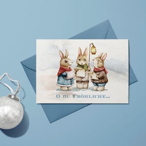 Biglietto d'auguri di Natale (biglietto pieghevole) | Tre simpatici coniglietti | Cartone premium di alta qualità | Incl. copertura | Piacevole al tatto (115 mm x 170 mm)