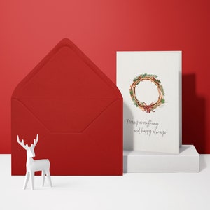 Tarjeta de Navidad divertida (tarjeta doblada) | Corona con lazo | Cartón premium de alta calidad | Incluye sobre | Sensación agradable (115 mm x 170 mm)