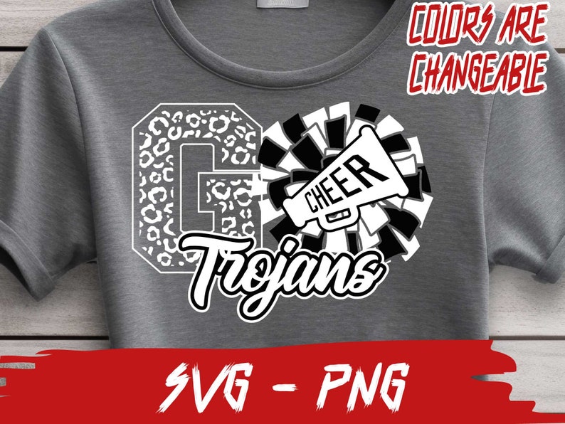 May include: A gray t-shirt with a white graphic design that says "Go Trojans" with a cheerleader's pom-pom and megaphone. The text "Colors are changeable" is in the top right corner of the image.