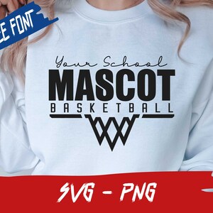 May include: White sweatshirt with black text that reads "Your School Mascot Basketball" with a basketball net graphic. The text "Free Font" and "SVG - PNG" are in blue and red boxes, respectively.