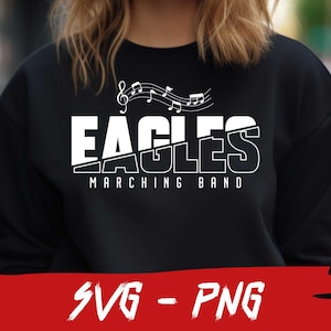 Pu&ograve; includere: Felpa nera con testo bianco che recita "Eagles Marching Band" e note musicali sopra il testo.