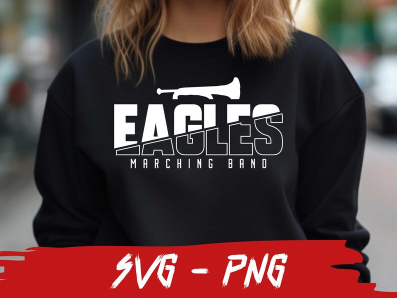 Pu&ograve; includere: Felpa nera con testo bianco che recita "Eagles Marching Band" e una silhouette bianca di una tromba.