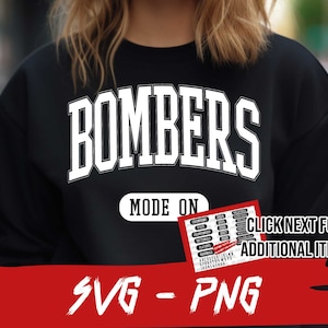 May include: Black sweatshirt with white text that reads "BOMBERS MODE ON". The text is in a large, bold font. There is a small red and white graphic with text that reads "CLICK NEXT FOR ADDITIONAL ITEMS" and an arrow pointing to the right.