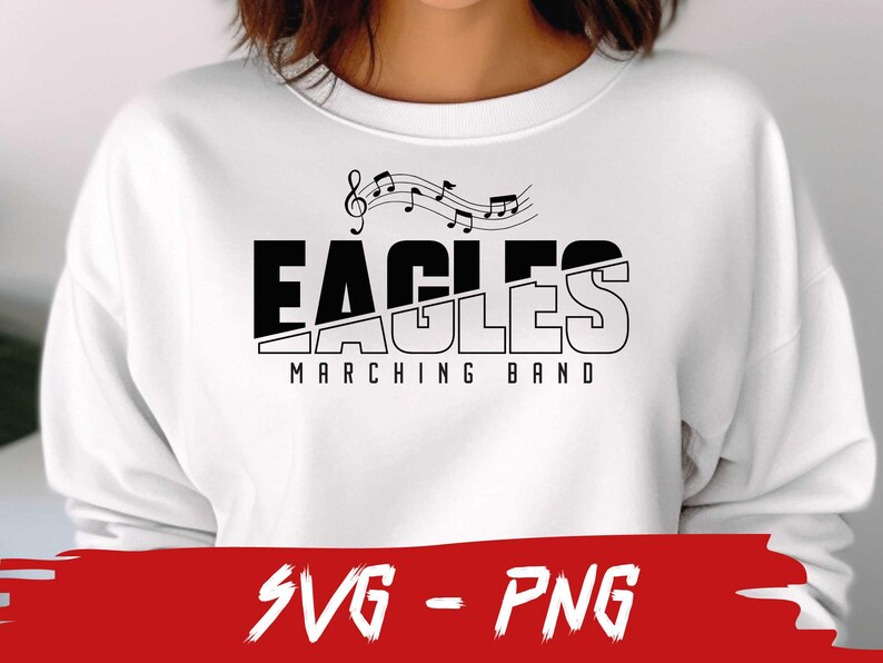 Pu&ograve; includere: Felpa bianca con testo nero che recita "Eagles Marching Band" e un design a nota musicale.