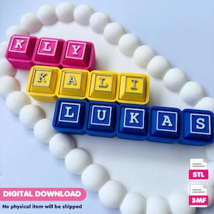 May include: Brightly coloured name blocks spelling out "Kelly", "Kali", and "Lukas" in pink, yellow, and blue. The blocks are arranged on a white surface with a string of white beads. The words "Digital Download" and "No physical item will be shipped" are also visible.