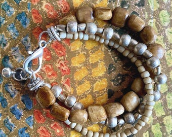 White cream beige and silver 3-row ethnic chic tribal handmade bracelet with artisanal glass, bone, silver beads.