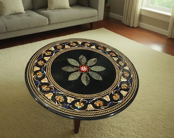 Mesa de centro artesanal de mármol negro con incrustaciones florales, elegante decoración para el hogar