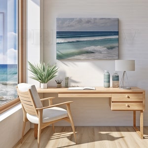 May include: A light wood desk and chair set in a bright room with a large window overlooking the ocean. A canvas print of ocean waves hangs above the desk. Decorative bottles, a lamp, and a potted plant are on the desk.