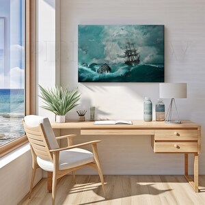 May include: A framed canvas print depicting a tall ship battling turbulent ocean waves under a stormy sky. The artwork features shades of teal, white, and gray, creating a dramatic seascape scene. The print is displayed above a wooden desk.