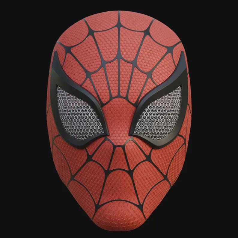 May include: A red and black Spider-Man mask with a web pattern. The mask has black eye frames with a mesh design and a textured surface. The mask is a full face covering.