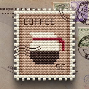 May include: A rectangular cross-stitch pattern shaped like a postage stamp featuring a brown background, the word COFFEE at the top, and the letters SC at the bottom. The centre displays a white coffee pot with a red handle and dark brown liquid.